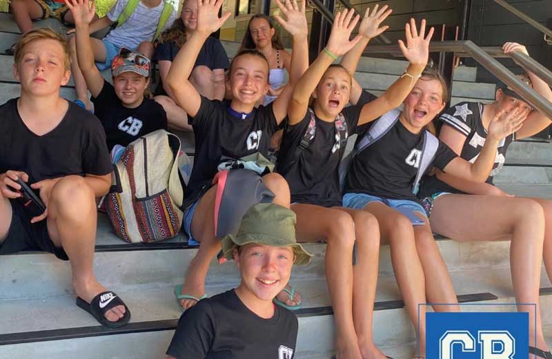 kids sitting on steps at a camp for kids