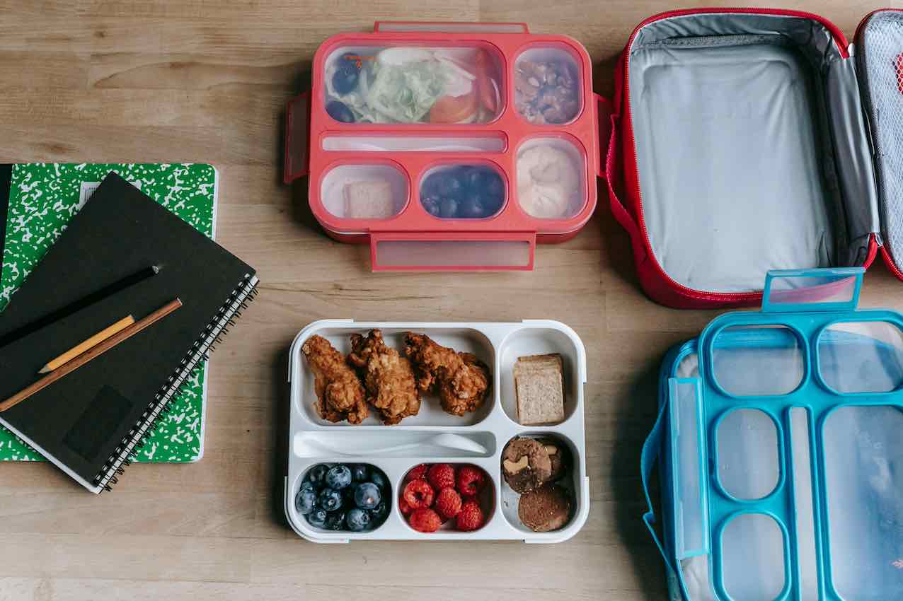 healthy lunch boxes on a desk